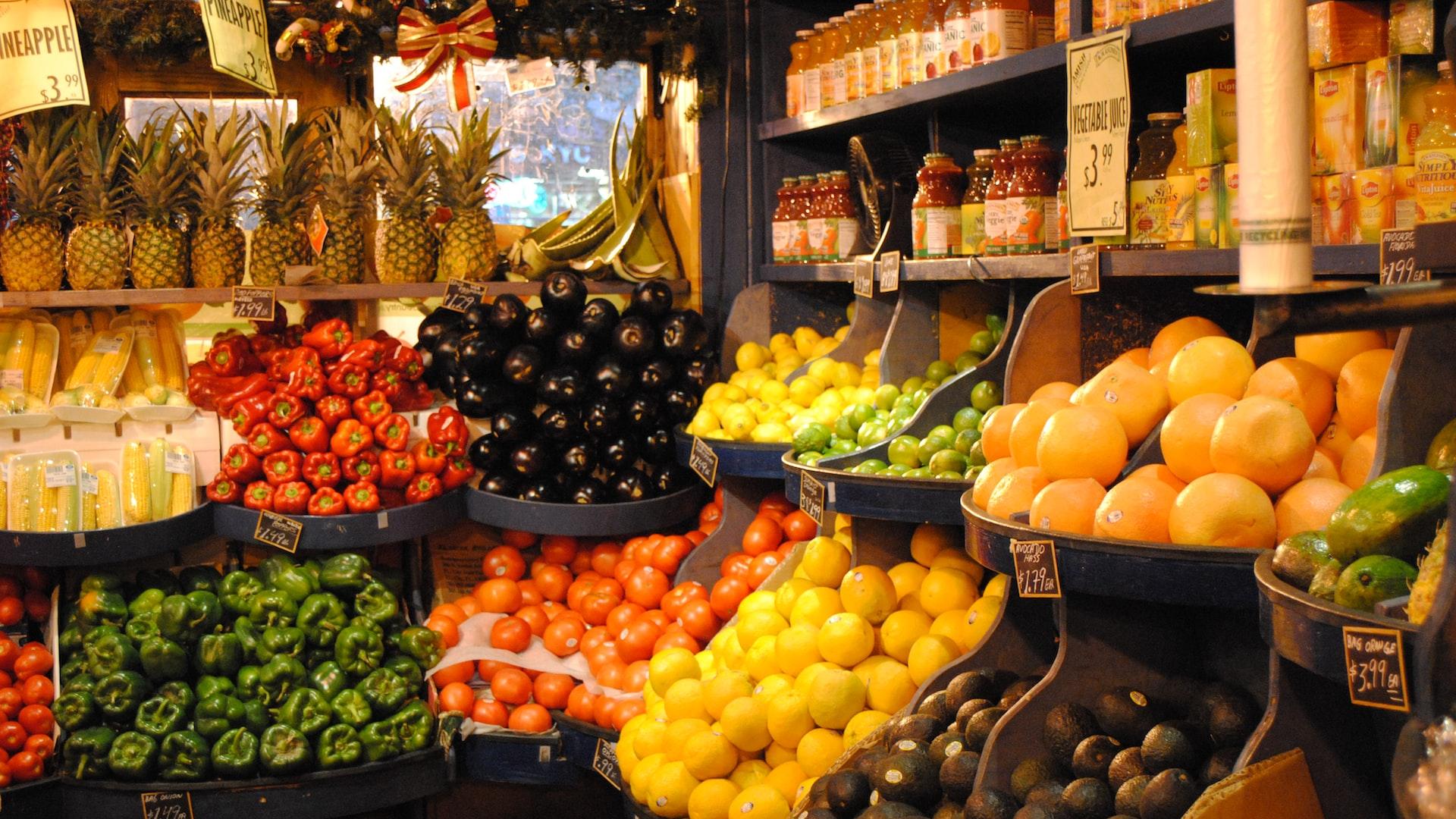 orange fruit on black fruit stand